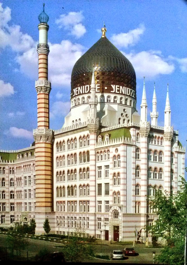 NouveauDeco's tweet photo. This is not only a remarkable building in the German city of Dresden, it also has a remarkable story.

The "Oriental Tobacco and Cigarette Factory Yenidze" is a former cigarette factory building constructed between 1907 and 1909 in Dresden. It is notable for its Moorish Revival exterior using elements from mosques and the Alhambra in Spain. There is also a bit of Jugendstil.

The man who ordered the building was Yenidze founder Hugo Zietz, born 1857, who imported tobacco from the Ottoman Empire.

Back then, Dresden authorities prohibited the construction of factories within the city which could be easily identified as factories. In other words, factories in the city center of Dresden could not look like factories. 

Therefore, Zietz came up with the idea to design the factory in the style of a mosque. The oriental building would not only meet the requirements of the city council (For instance, the minarets were chimneys) but also serve as an advertising monument for his oriental, Turkish, cigarette brands. 

In 1907, Hugo Zietz hired the architect Martin Hammitzsch to build the factory. (Btw, Hammitzsch later married Angela Hitler, the half sister of German wacko Adolf Hitler). In 1909 the job was done. After completion, the building became known in Dresden as the "tobacco mosque".

After WWI, Hugo Zietz sold the Yenidze factory to a competitor. Zietz died in 1927.

During WWII one third of the factory was destroyed during allied bombing raids. Parts were rebuild. Until 1953, when Dresden was part of East Germany, the building was a cigarette factory. Later it became a storage for cigarettes.

In 1997 the building was renovated. Today it is an office building and a restaurant.

Pic: Eddycards