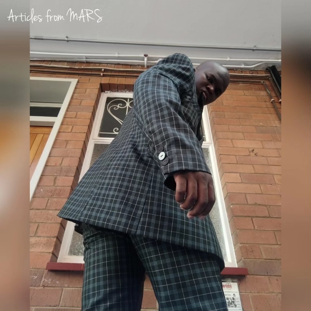MARS_is_dope's tweet photo. The 2023 CHECK AND CHAIN SUIT minimalised to:

1. A white formal long sleeved white shirt with an irregular pentagonal back yoke;
2. Dark green, check print suiting close fit leg &amp; multiple waistband pair of pants; and
3. A dark green check print suiting classical jacket. https://t.co/T81cCa5R4R