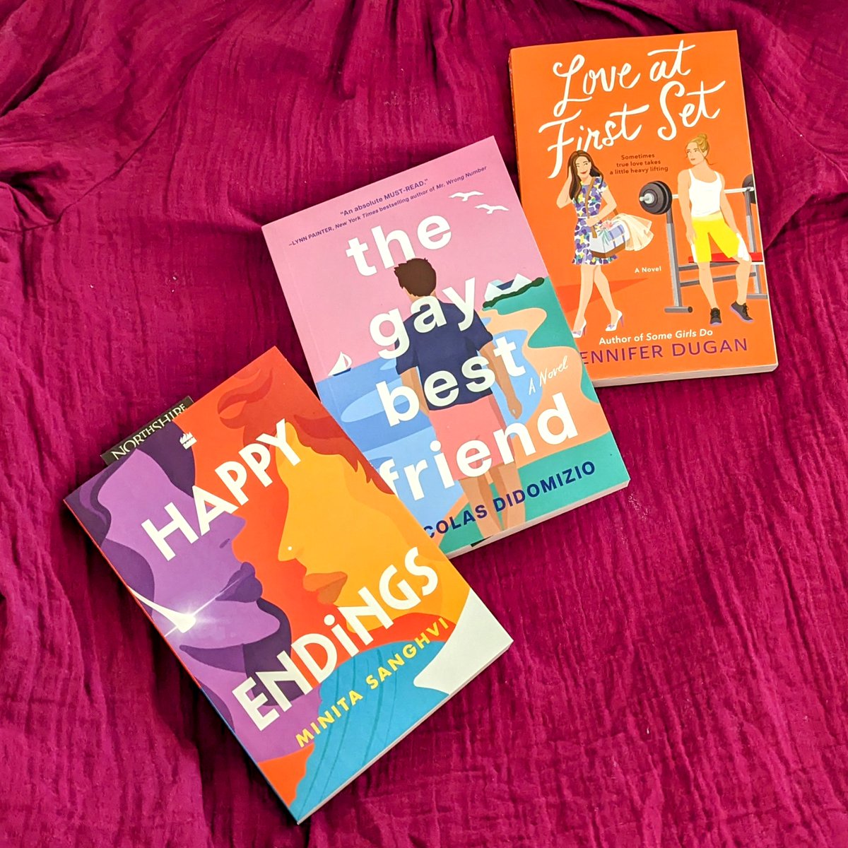 Look at these beautiful books that I brought home from the Love is Queer romance panel last night! I had such a wonderful time at the event. Loved meeting <a href="/minitawrites/">minitawrites🏳️‍🌈</a>, <a href="/ctnicolas/">Nicolas DiDomizio</a>, and <a href="/JL_Dugan/">Jennifer Dugan Updates</a> and can't wait to read their new releases! 🧡💗