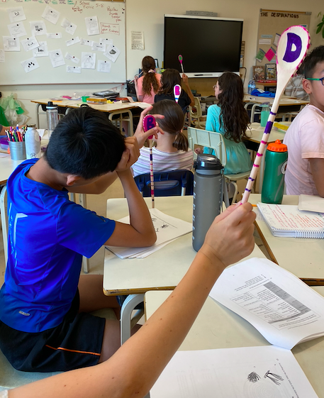 BPSHawks6's tweet photo. Students reviewing our science concepts and building multiple choice writing skills with a spoon game. Many debates were held as they tried to sway their teammates. Winning choices were celebrated with epic cheers! #BPSHawks6 #BPSHawksLearn #WeAreCBE https://t.co/3CEF4o1tWO