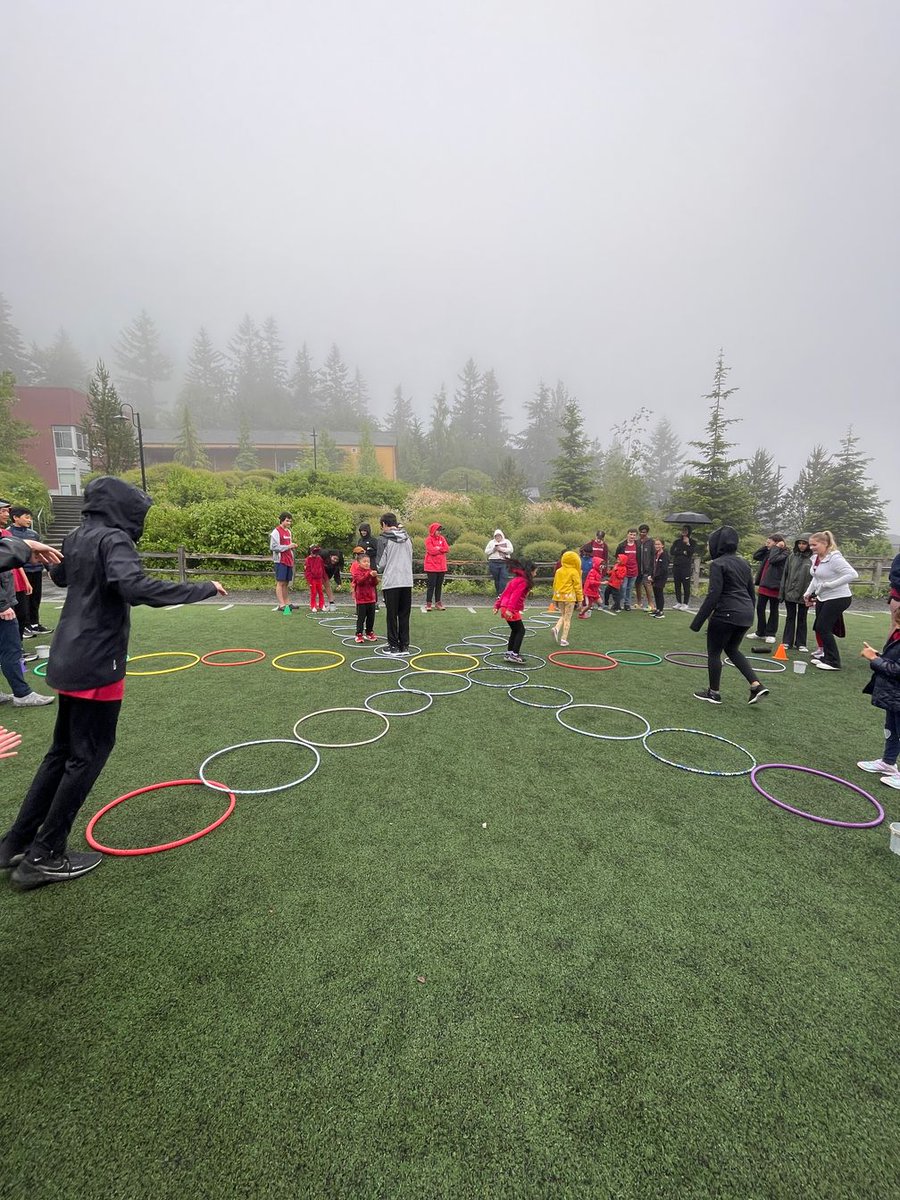 OWSBobcat's tweet photo. Foggy Field Day includes sack races, tag, push the tire, GaGa Ball, parkour, games, and cup stacking, and the traditional rainbow photo (on a cloudy day). https://t.co/FEQ9wxy00f