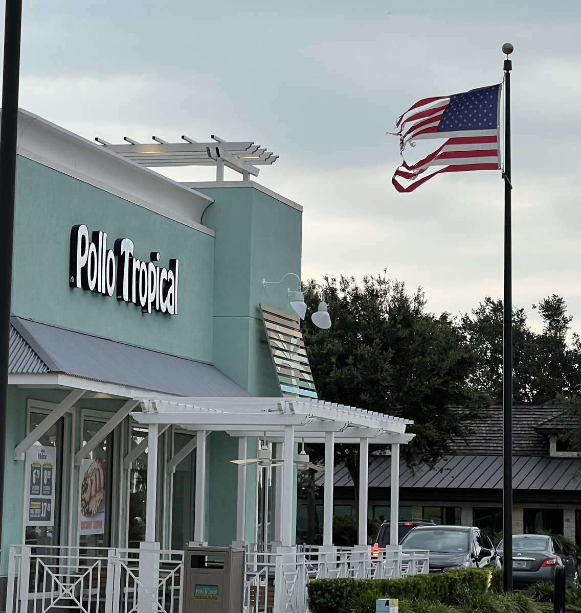TLF66's tweet photo. @pollotropical this flag at the S Semoran location in Orlando is in serious need of replacement. It is a disgrace to my the #AmericanFlag in this condition. https://t.co/BQ32rQ2uyO