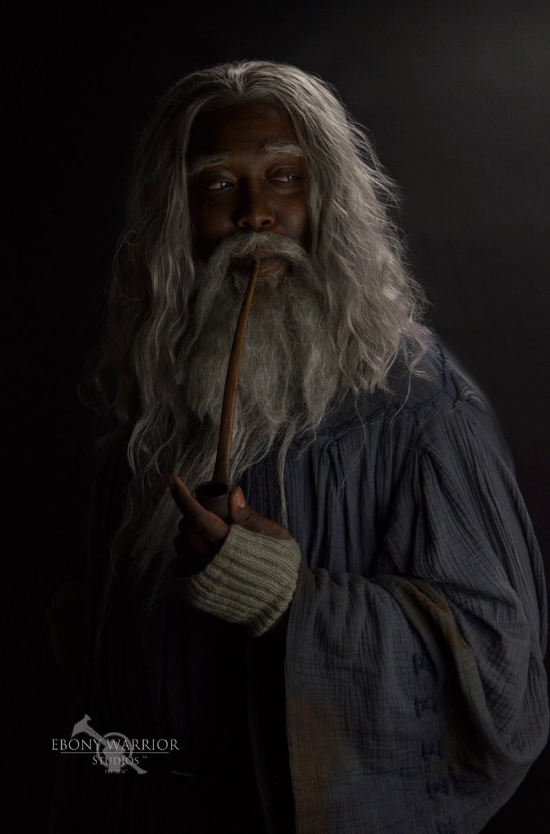 “…his long white hair, his sweeping silver beard, and his broad shoulders, made him look like some wise king of ancient legend. In his aged face under great snowy brows his eyes were set like coals that could suddenly burst into fire.'  #cosplay #gandalf