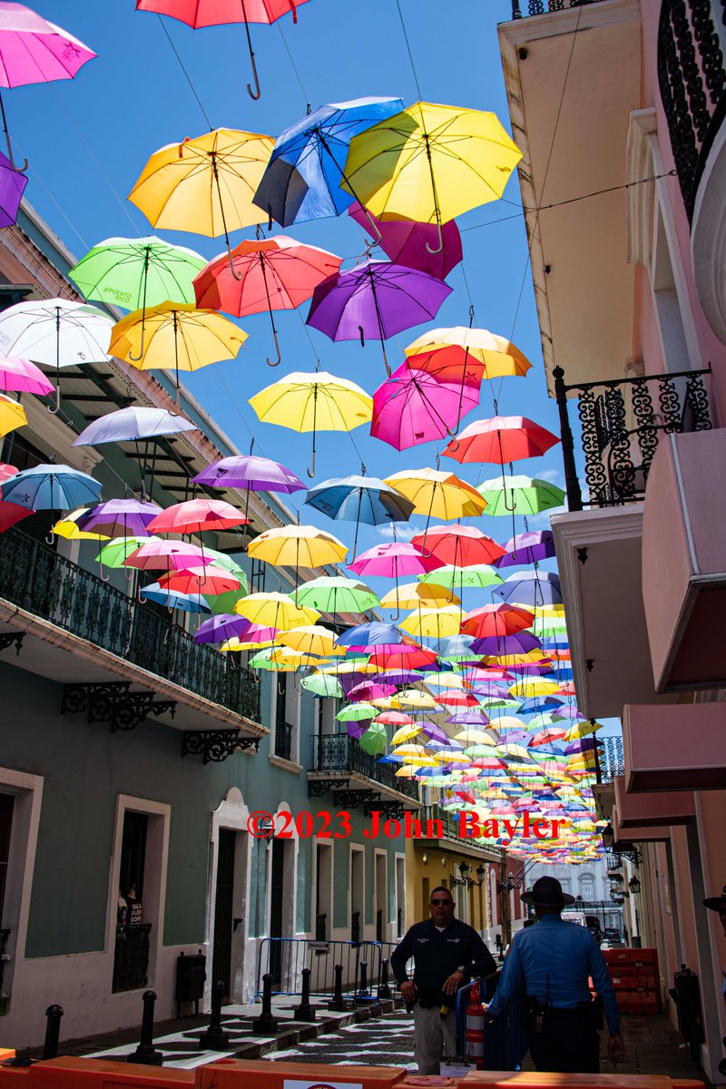 JohnBaylerPhoto's tweet photo. Umbrella street in Old San Juan.  AKA Calle Fortaleza it is one of the main streets in Old San Juan. These are right by the governor's home and are a symbol of coming back after the darkness of hurricane Maria. #umbrellastreet #oldsanjuan #johnbaylerphotography #posthurricane https://t.co/3LKoDoUHAm