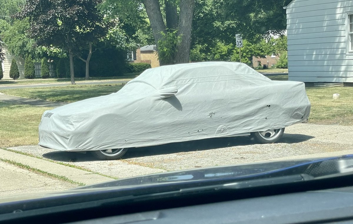 Identify this car: #CarCover #MysteryRide