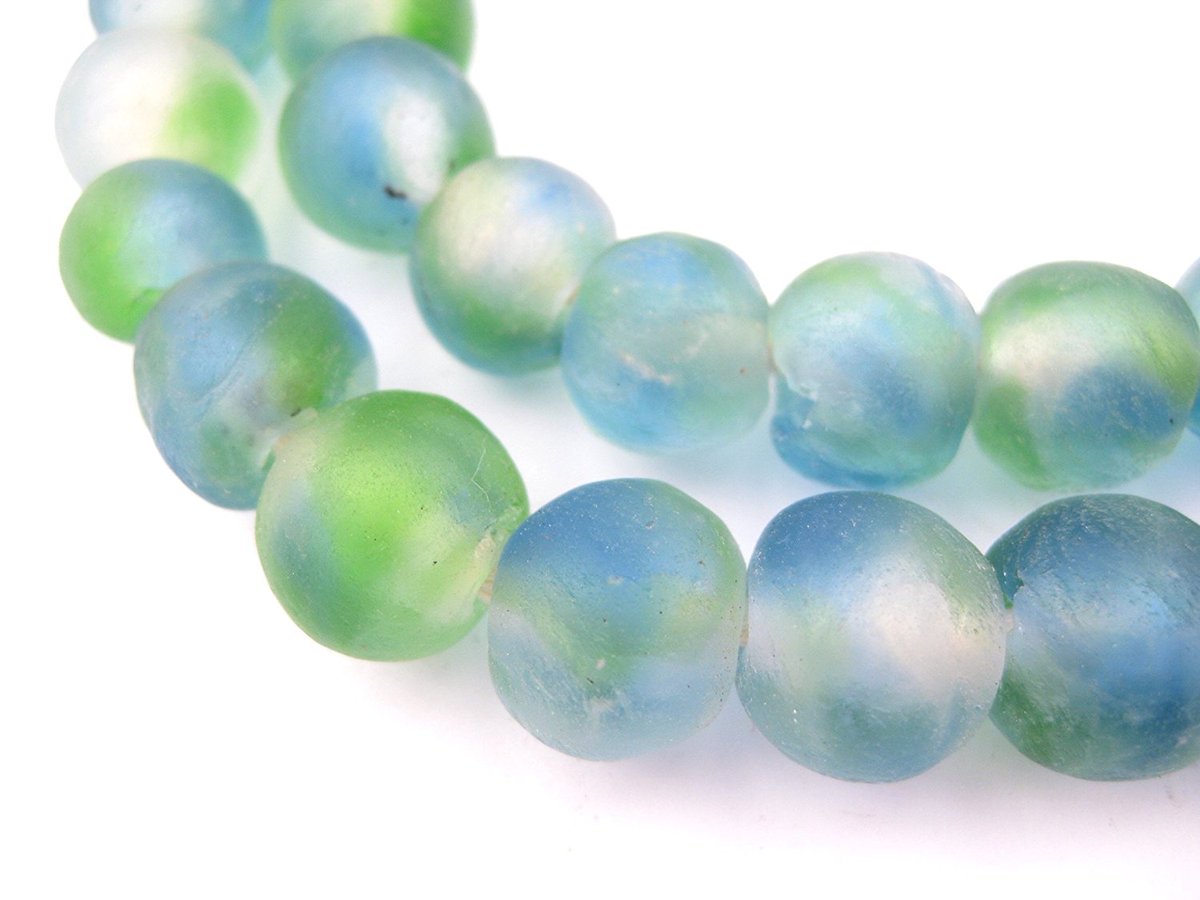 Beautiful recycled blue green glass beads present a lovely first impression. They also help women rise above their environment to make a better life for themselves. bellartistry.com/blue-green-gla… #FairTrade #Africa #Ghana #necklace #womensrights #recycling