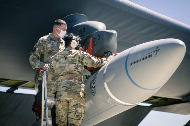 Crew members from the 912th Aircraft Maintenance Squadron secure the AGM-183A Air-launched Rapid Response Weapon Instrumented Measurement Vehicle 2 as it is loaded under the wing of a B-52H Stratofortress during a hypersonics test.