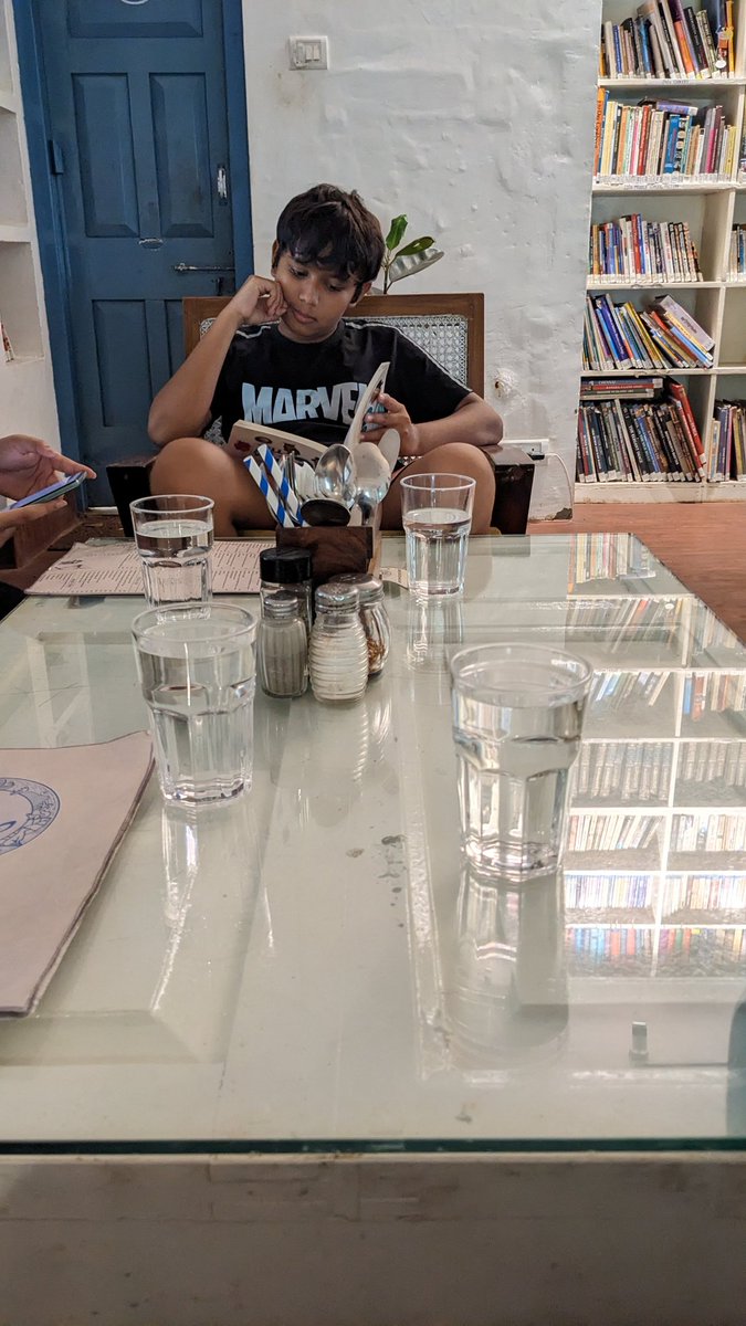 pranayswain's tweet photo. Pick up a book from the shelves around....flip through the pages as you wait for the food to arrive.. that's @Cafe16_SN for you. Sheer beauty
#16Satyanagar
#Bhubaneswar
#BakulLibrary https://t.co/VRXUZg5dYE