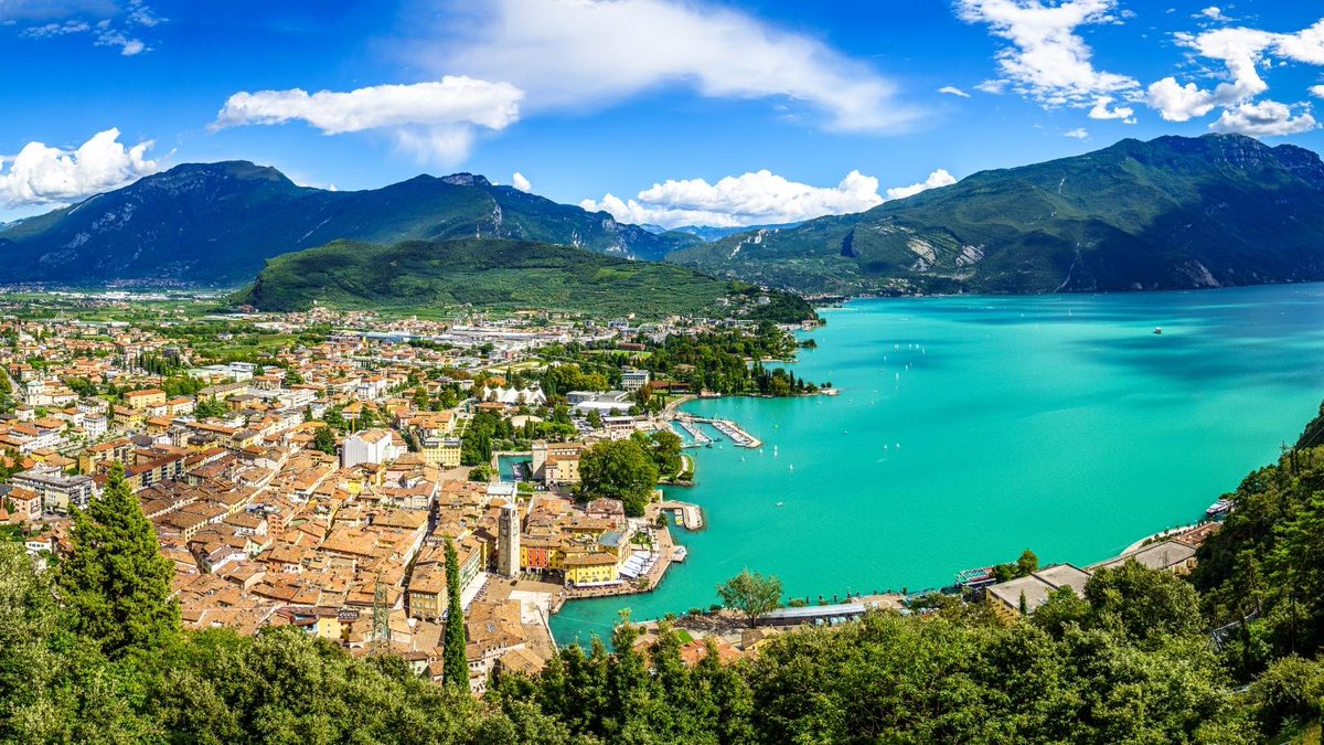 This #October join us for a dreamy adventure to #LakeGarda ! Enjoy the beautiful alpine views and crystal-clear waters💭🏔️ 🌊💎 

Will you be joining us on this incredible journey? 👋 

Book now bit.ly/3oUrUmw

#ExploreEurope #Italy #VisitItaly #Travel #CoachHoliday
