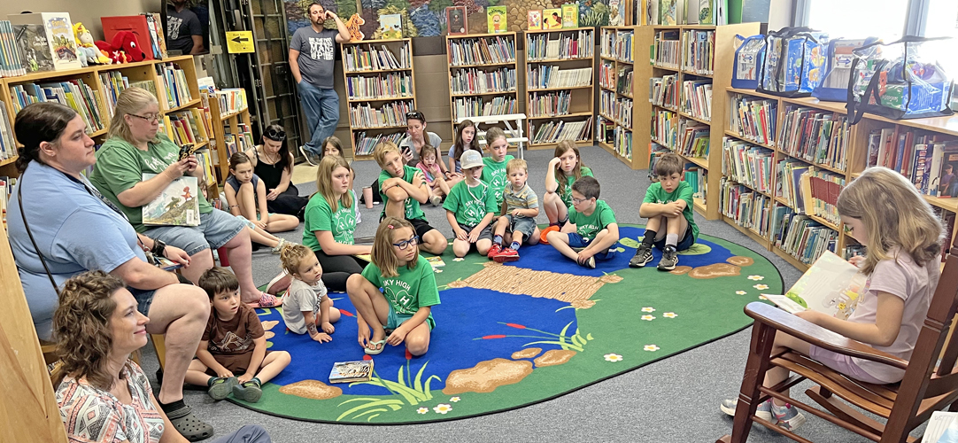 BethanyClipper's tweet photo. Bethany, MO: Allie Baker of the Sky High 4-H Club reads during the story time Saturday morning at the Bethany Public Library. More than 20 members of the 4-H Club took part in story time. The club meets at the First Baptist Church.--Republican-Clipper photo, Phil Conger https://t.co/0ztJeYKWSH