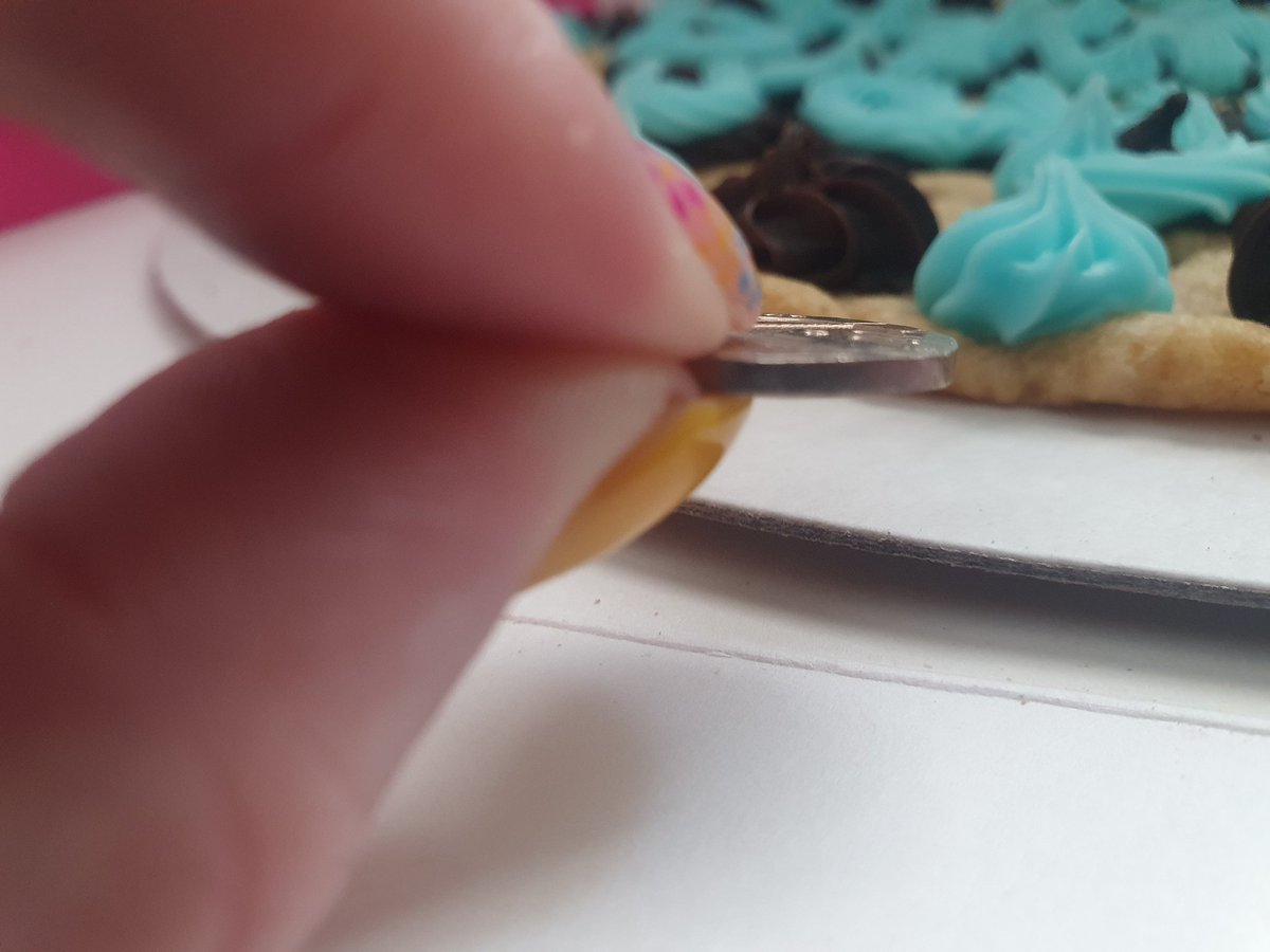 amyr09's tweet photo. My sons birthday cookie. It was so thin it fell apart. (That's a 20p in the photo for reference). The shop assistants only explanation was to say she's only been there 2 weeks, no choice to be refunded or remade. Customer service offer a treat box! Awful company https://t.co/QV8Hd8PWrJ
