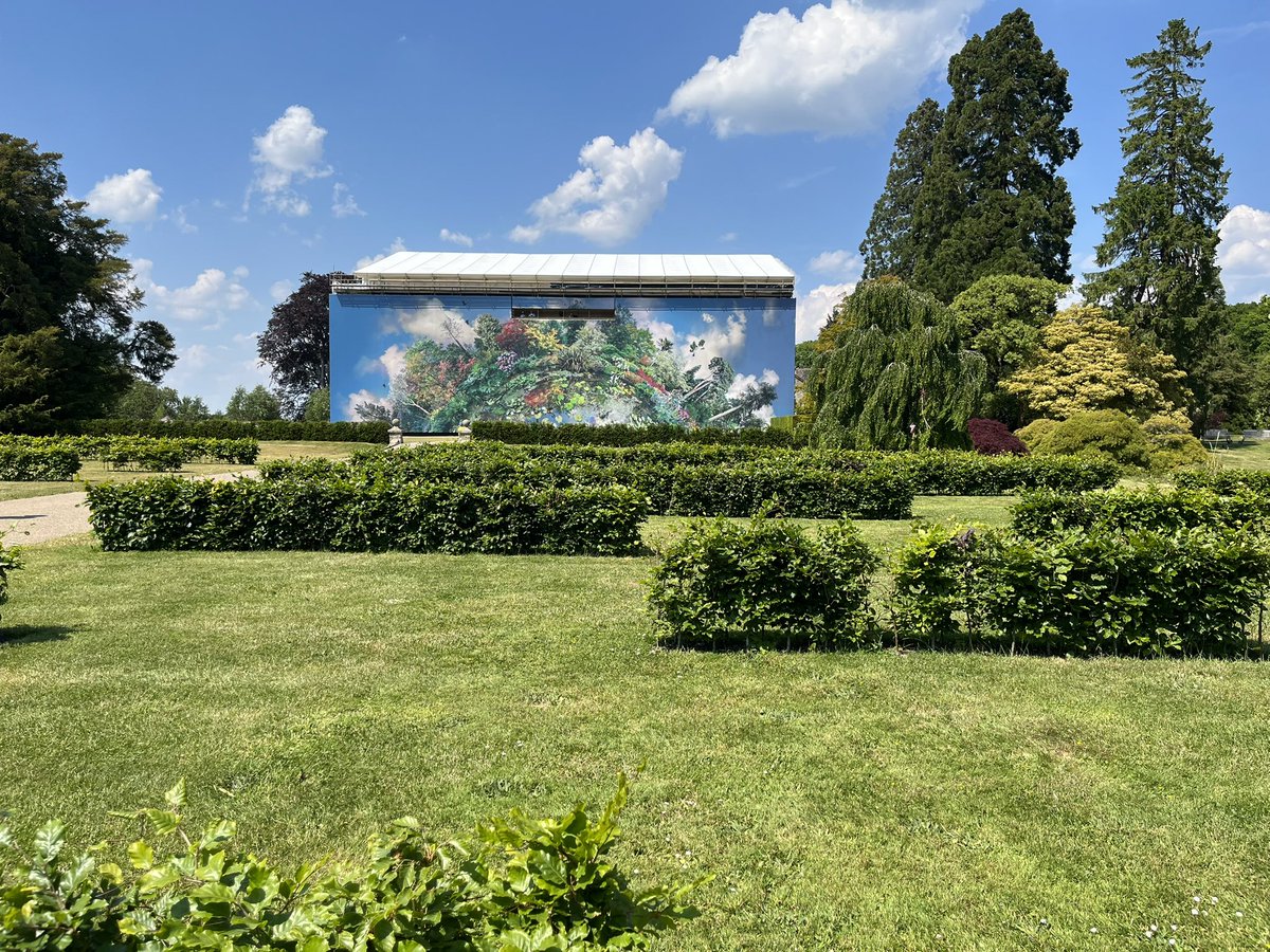 politic_animal's tweet photo. While the Tudor manorhouse itself is currently contained within a vast scaffolding tent for works to repair its slate roof, I love how it is being handled: huge artworks on the outside, and a viewing platform within the tent that puts you up among the chimneys. https://t.co/2HKtotDTEG