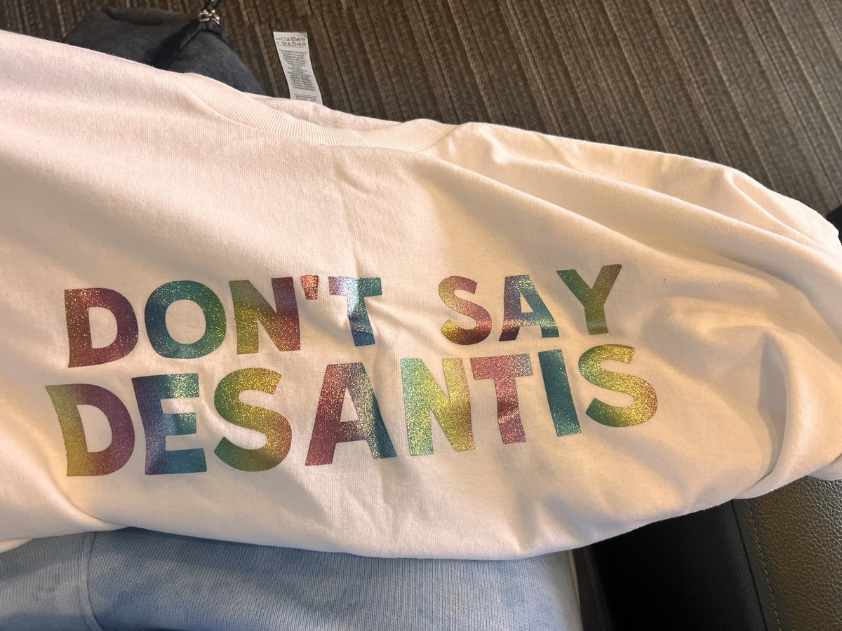 LyftGyft's tweet photo. On my way to Florida. You think my shirt is appropriate? I hope @GovRonDeSantis @RonDeSantis doesn’t see it. Ha ha ha. 🖕🏽 https://t.co/YK4RBCHNF2