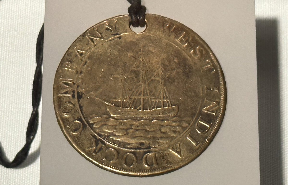 drdan_o's tweet photo. Galleries of @MuseumofLondon - London, Sugar and Slavery: a token from the West India Dock company, an image of the import dock in London,  a cargo book for a West India trade ship and brass manillas from the 1600s - used as currency for the purchase of enslaved Africans #MoLD20 https://t.co/nCw1Oj1izI