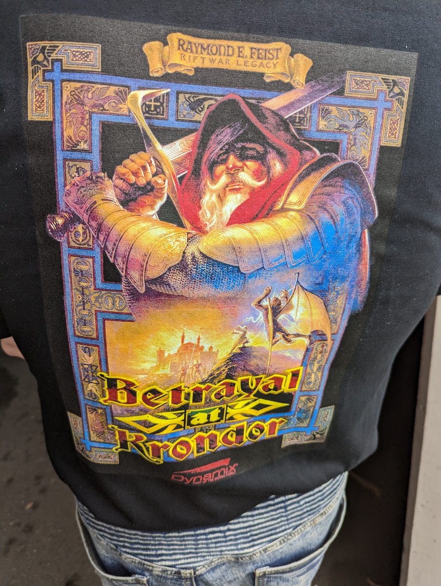 nealiios's tweet photo. Thirty years can do some damage. Fading, wear, cracking. It was time for a refresh. Not bad for a scan off a thirty-year-old laser print. (BTW, the blue in the photo on the new shirt is WAAAAY brighter than how it actually looks in real life. Not sure why. #BAK30 #Krondor30 https://t.co/h8LeXFCO5S