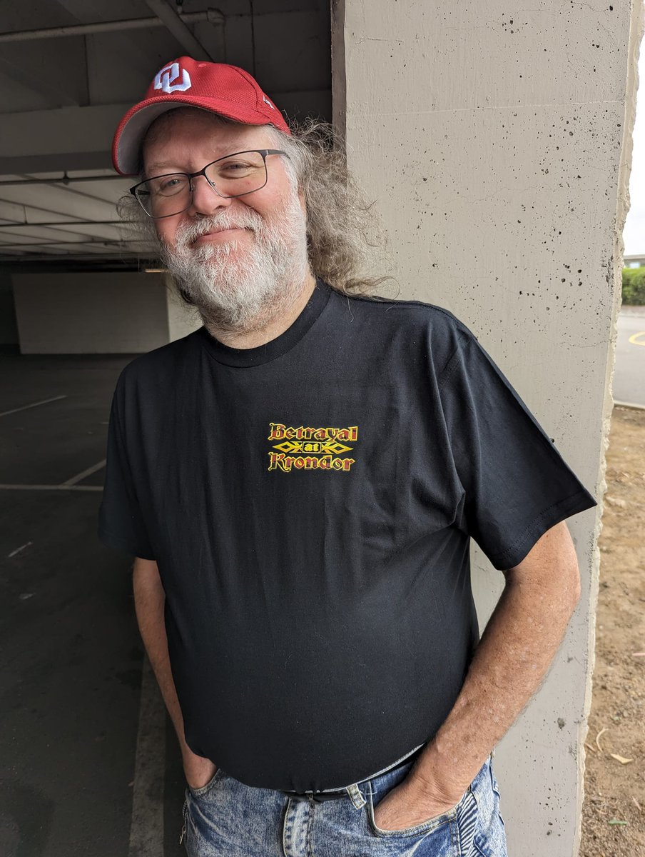 nealiios's tweet photo. Thirty years can do some damage. Fading, wear, cracking. It was time for a refresh. Not bad for a scan off a thirty-year-old laser print. (BTW, the blue in the photo on the new shirt is WAAAAY brighter than how it actually looks in real life. Not sure why. #BAK30 #Krondor30 https://t.co/h8LeXFCO5S