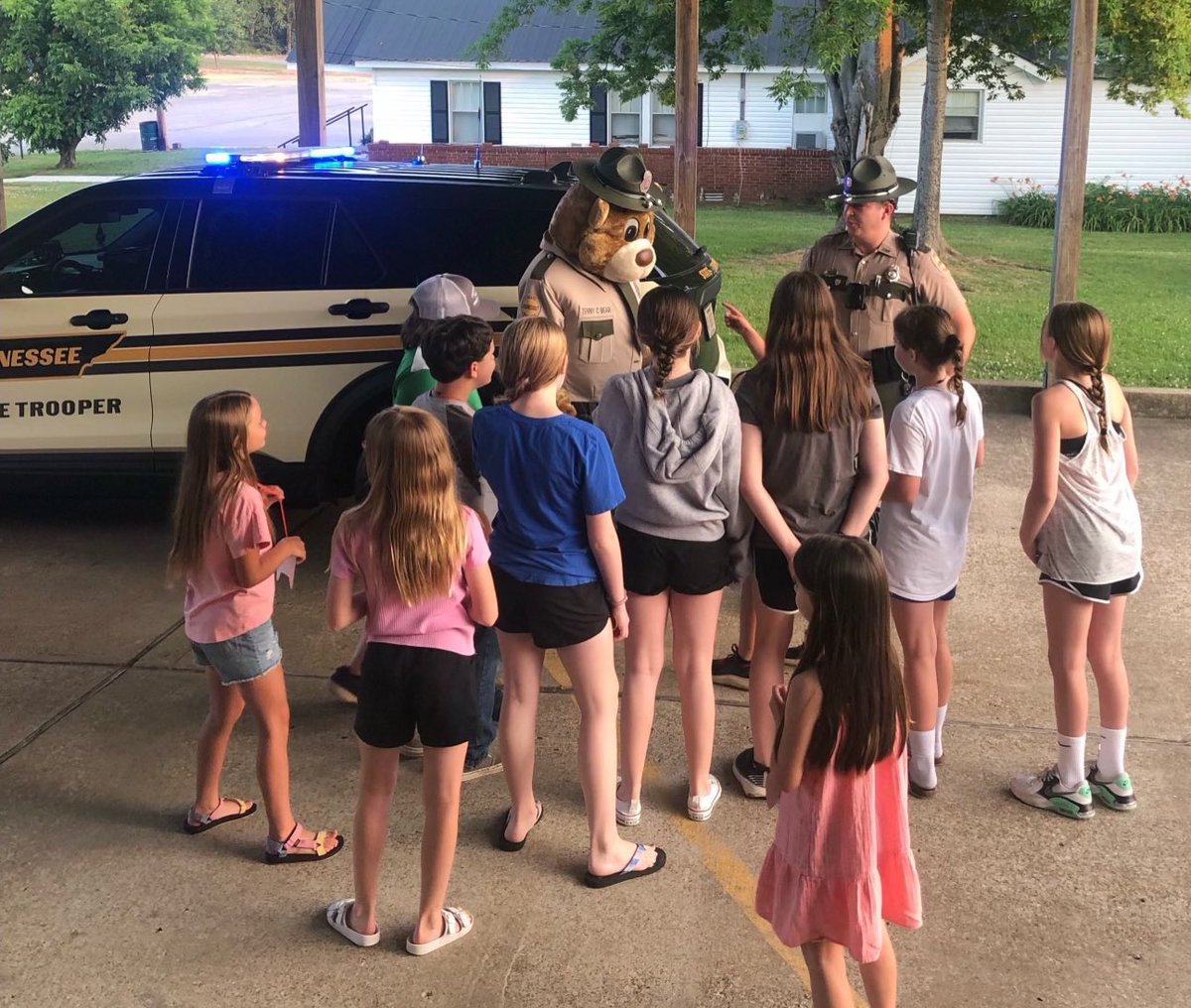 THPJackson's tweet image. Trp. Walls, Lt. Davidson, and Tenny C. Bear visited some youngsters at Decaturville First Baptist for VBS. Kids got a chance to see a patrol car up close and personal and hang out for a while. #perksofthejob #JoinTHP