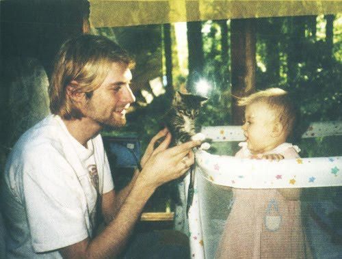 Kurt Cobain, his daughter, and a kitten, 1993