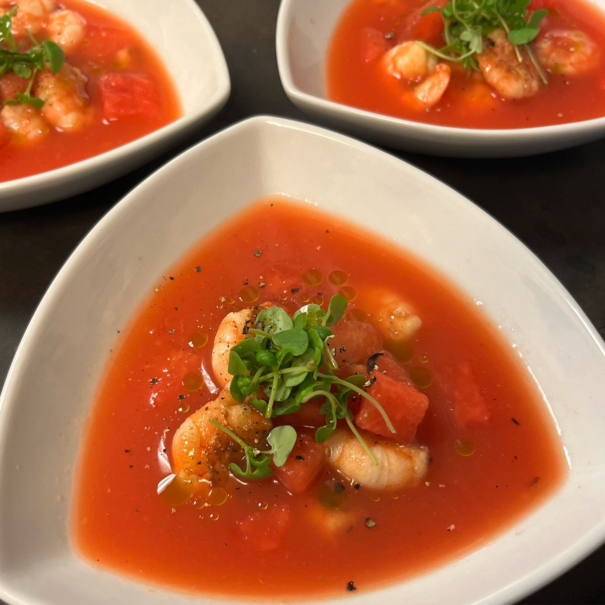 Summer in a bowl - One of tonight’s private party starter.
King Prawns in a Melon Gazpacho with micro basil & herb oil.

A not so classic cold soup as fresh watermelon is the base, but perfect for one of the hottest days of the year.

#gazpacho #coldsoup #privateparty