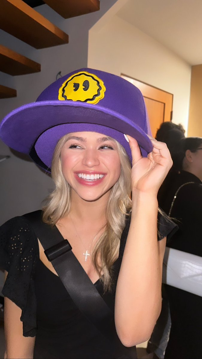 Everyone looks good in a big purple hat