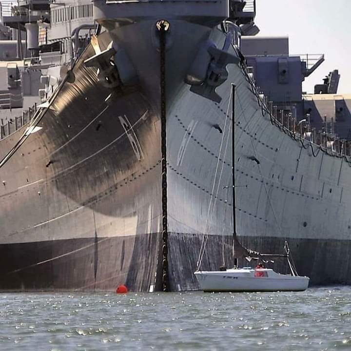1SafetyLast's tweet image. Sailboat is dwarfed by the 
#USSIowa battleship as it sits at dock in Richmond,  2012. The Iowa was ready to be towed to Los Angeles to become a permanent museum 

By Michael Short/Special to the Chronicle