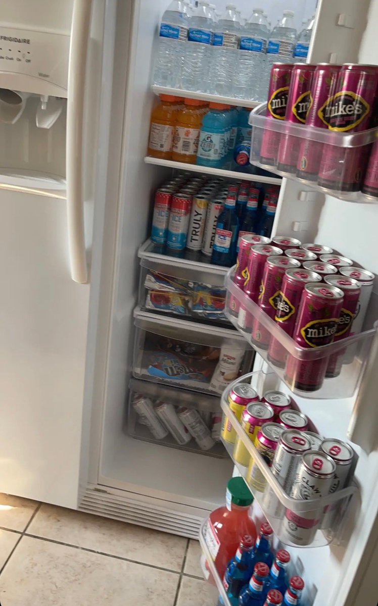 Comfortably_ill's tweet photo. My kid is at a beach house for the next week celebrating her graduation and senior week aka #SWEEK and she sends me this pic of how she organized the house beverage fridge. OCD runs in the family. Gosh I love her. #Senior2023 https://t.co/pJINyGIodv