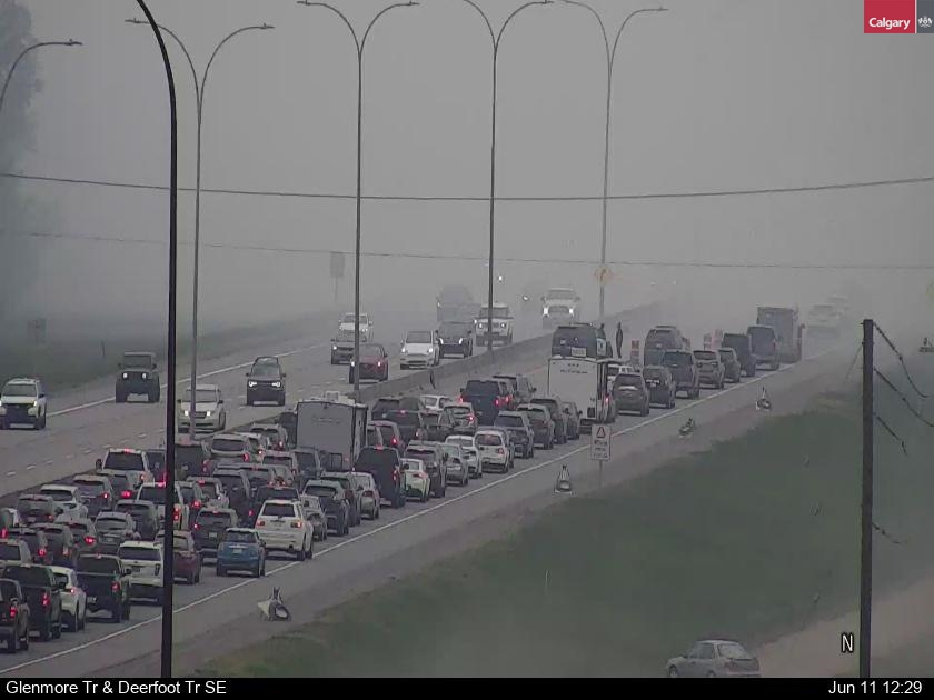 yyctransport's tweet photo. UPDATE: Hazardous Road Condition on Deerfoot Tr north of Glenmore Tr SE, smoke reducing visibility. Multiple lane closures NB and SB. Please drive with caution and expect major delays in the area.  #yyctraffic #yycroads https://t.co/MOdqT4l7EO