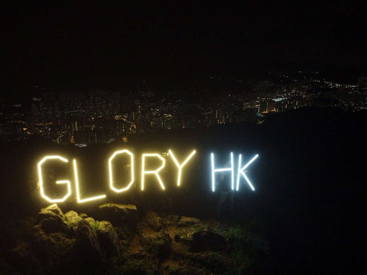 A group of Hong Kong activists displayed light-up signs reading 'Glory' and 'Hong Kong' atop Lion Rock last Friday night, as the city marked four years since an estimated one million people march in protest of an extradition bill.