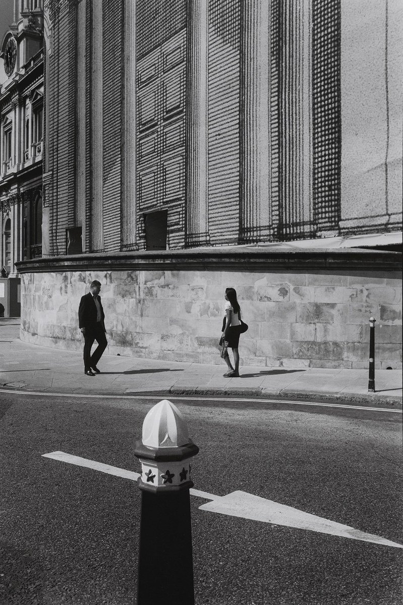 Figures in the city no. 20
St Paul's, London, 2005
Silver gelatin print
#London #StPauls #City #streetphotography #figures #pedestrians #man #woman #walking #blackandwhitephotography #monochrome #analogue #film #bnw #urbanlandscape #cityscape #arrow #bollard #sunlight #shadows