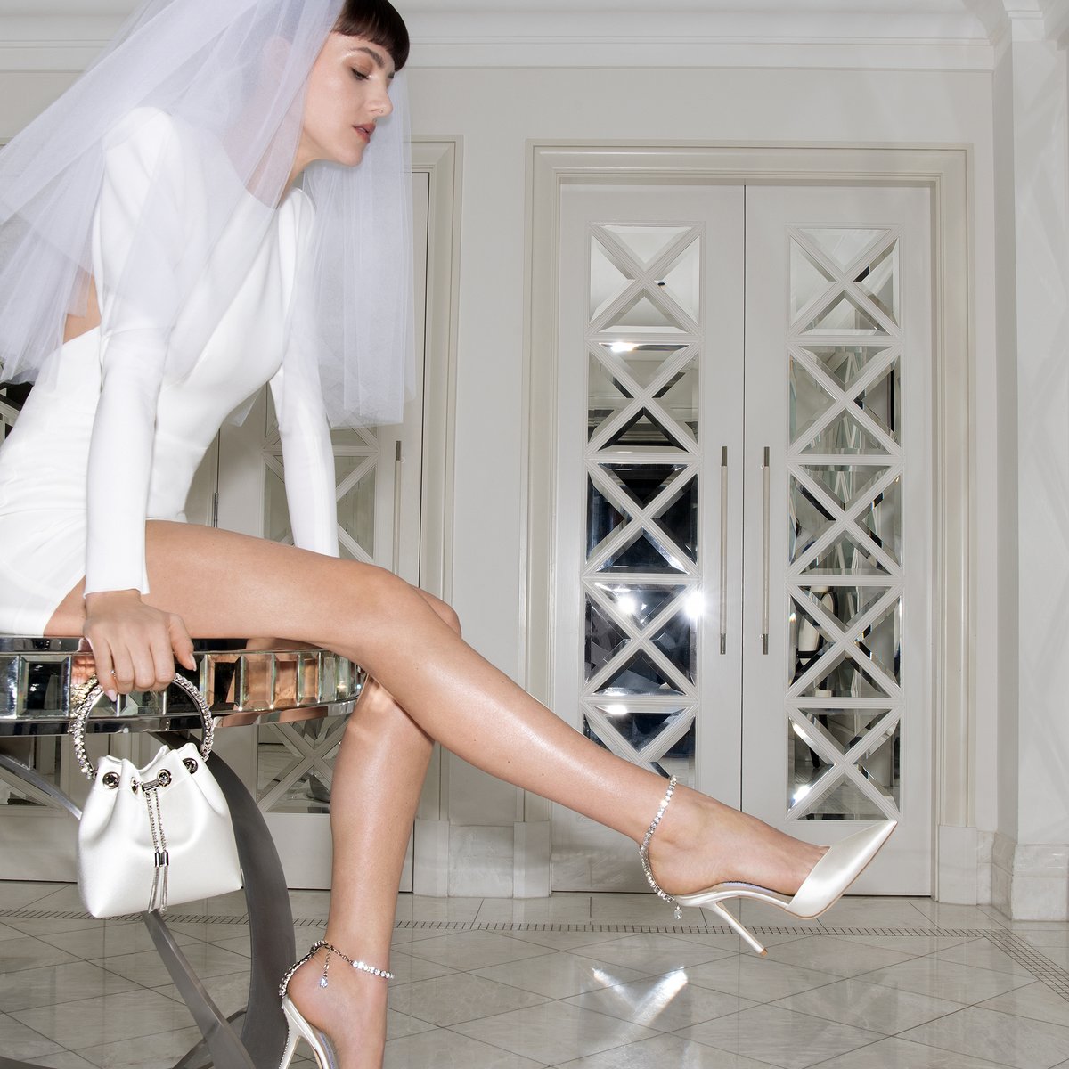 Ensure your bridal style is suitably romantic with our iconic Saeda pumps and Bon Bon handbag - a match made in heaven
#IDoInChoo  

jimmychoo.com/.../bridal.../…