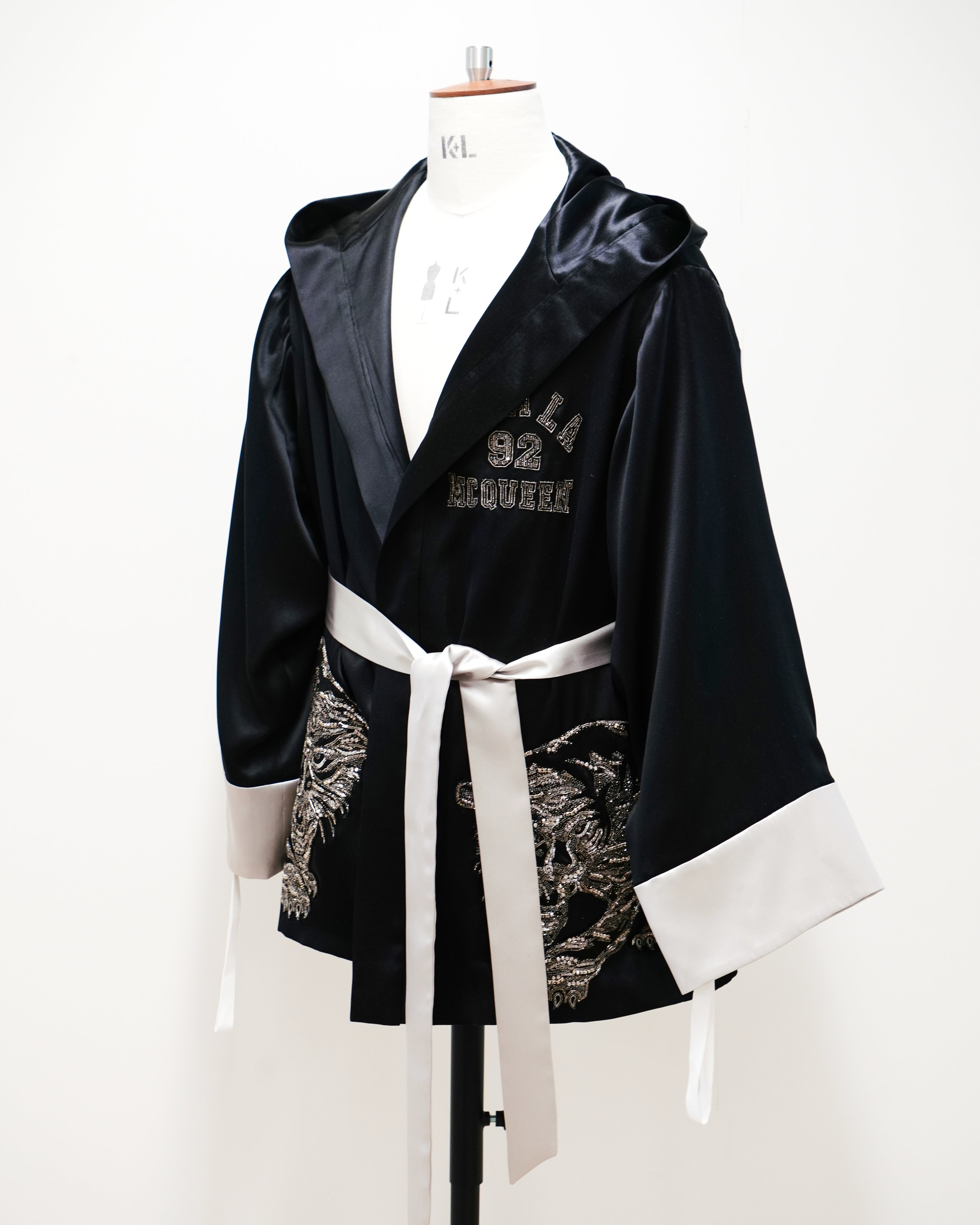 Alexander McQueen on X: @ramlaali Custom-made for #RamlaAli, captured  inside the London #McQueenAtelier. The hooded boxing robe was designed with  double-face silk satin and personalised crystal hand-embroidery for Ramla's  fight for the #
