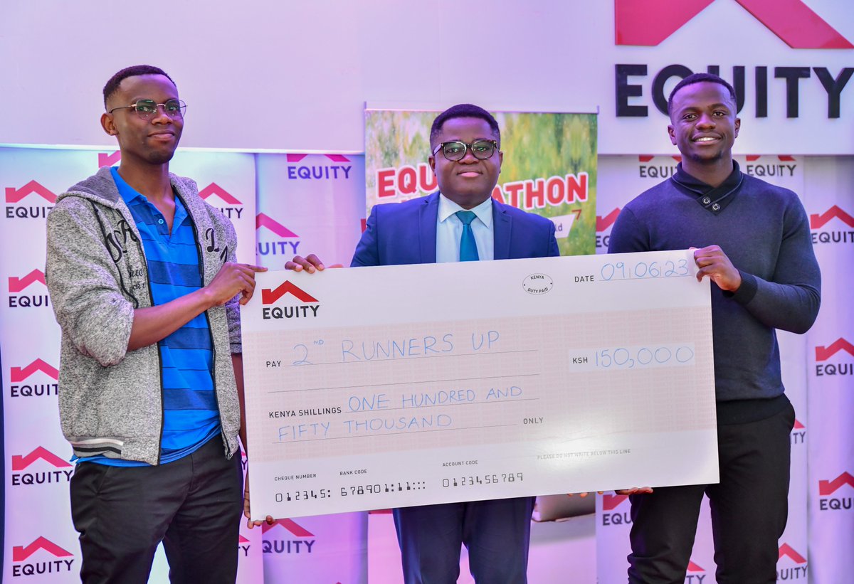 Samora Laurent (far left) and Brackly Murunga (far right) receive a dummy  cheque of Ksh 150,000 as 2ndrunners-up under the Social Outcomes category #EquityHackathon