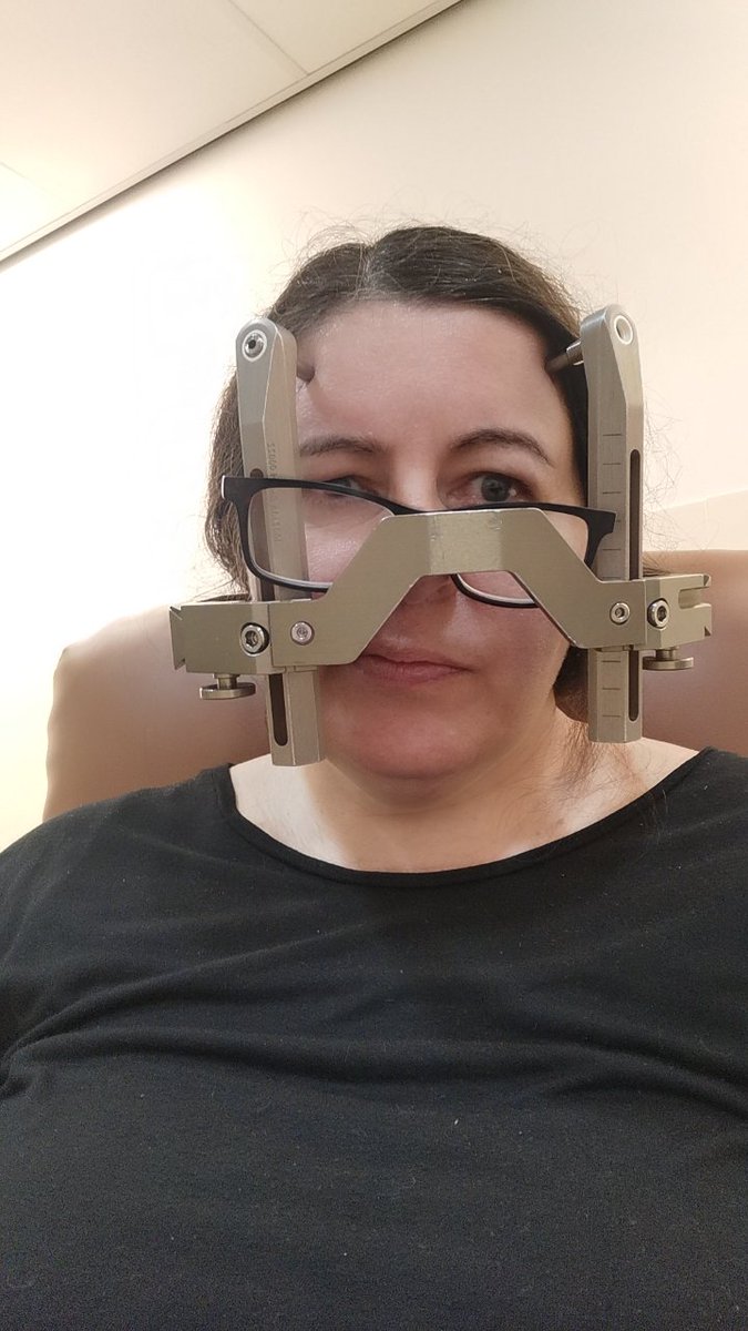 Trying to read, failing miserably. In fact there's not much you can do with a metal cage bolted to your skull 🤦🏻‍♀️