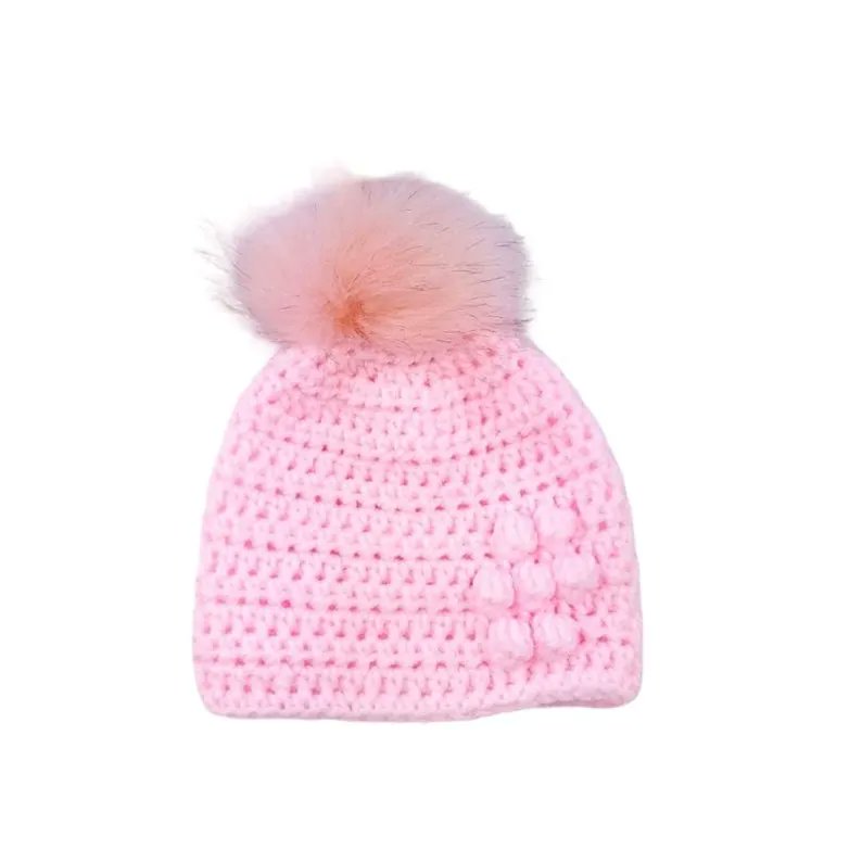Pink baby crocheted hat with flower detail and detachable pink faux fur pompom with brown tips buff.ly/3o2W0E4 #knittingtopia #etsy #handmade #tweetuk #etsyRT #pompomhats #babyhat #babyclothes #uksmallbiz #MHHSBD #craftbizparty