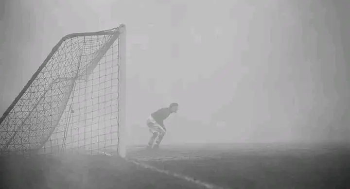 @ChaaliiyKay In 1937, a match between Charlton & Chelsea at Stamford Bridge was stopped in the 60th minute due to thick fog. 

Charlton goalkeeper Sam Bartram remained in front of the goal 15 minutes after the whistle as he didn’t hear the referee blow it due the crowd behind his goal.