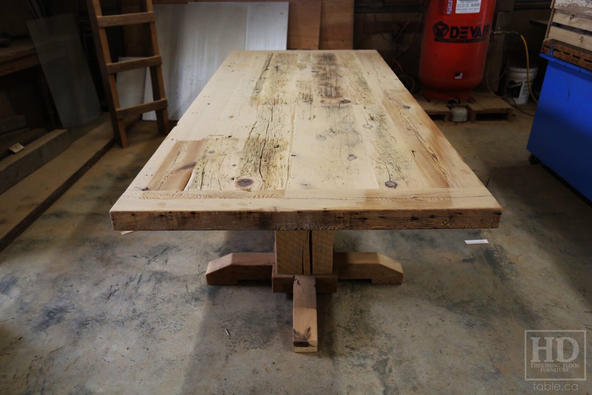 8.5′ Ontario Barnwood Table Set we made for a Muskoka cottage – 46″ wide – 3″ [extra thick option] Joist Material Top – Hand-Hewn Pedestals Base – Reclaimed Hemlock Threshing Floor Construction – Original edges + distressing maintained – Premium epoxy + satin polyurethane finish…