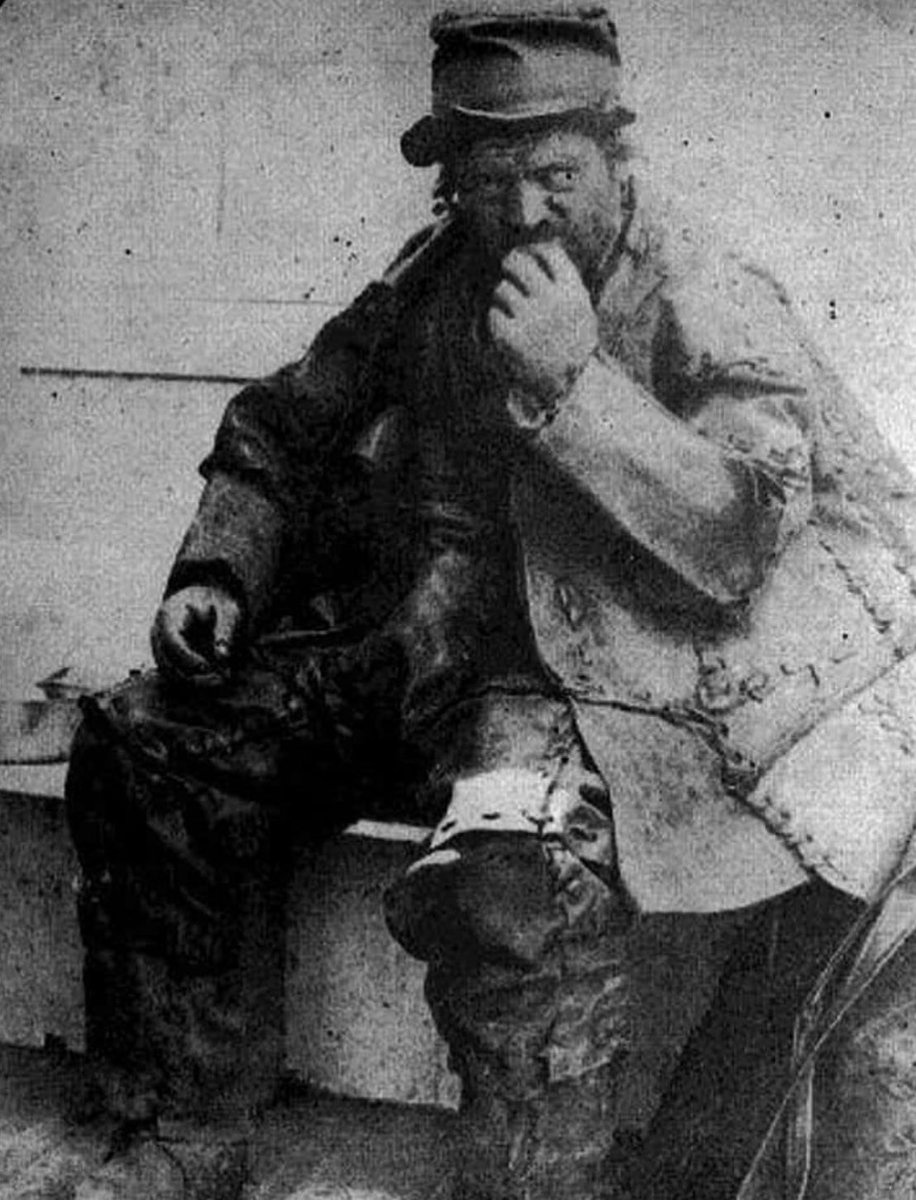 historyinmemes's tweet photo. A mysterious figure known as the "Leatherman" would routinely travel a 365-mile circuit in the 1800s for no discernible purpose. Although no one ever discovered his name, place of origin, or motivation for making the journey, he rose to fame as a well-liked local hero.

In all types of weather and during all four seasons, the Leatherman wore a boot suit—an outfit made out of worn-out leather boots and ties that weighed over 60 pounds. Locals could determine the time based on where he was because he slept in caves and kept his schedule so well. Every 34 days, the Leatherman completed the journey between the rivers of the Hudson and Connecticut, passing through 40 little towns.

Though he never spoke beyond a few grunts in English or French, adults and children in the town looked forward to his visits. When the Leatherman stopped by a home, it was considered an honor, and schoolchildren stayed on their best behavior in hopes of being chosen to bring the Leatherman food when he passed their campuses.

After he perished, so many people visited the Leatherman's roadside grave that the local historical society decided to move it farther inland to avoid potential accidents. When the body was exhumed for reburial in 2011, many thought DNA testing might help solve the mystery of who he was.

However, those hopes were dashed when they opened the casket to find that the remains were missing. Now, the Leatherman is shrouded in even more mystery: no one knows who he was or where he is.