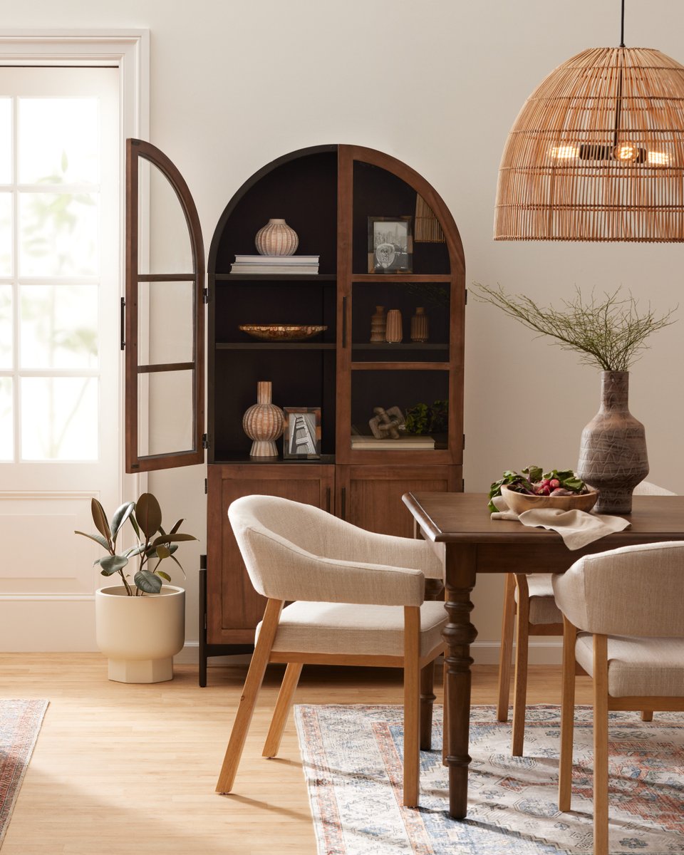 worldmarket's tweet photo. Trend Alert! 😍 Our Amira Vintage Walnut &amp; Charcoal Black Arch Display Cabinet is a stunning addition to any room in your home.

Shop this cabinet here: https://t.co/sLz6VgCVpk https://t.co/74Aq9Stpb7