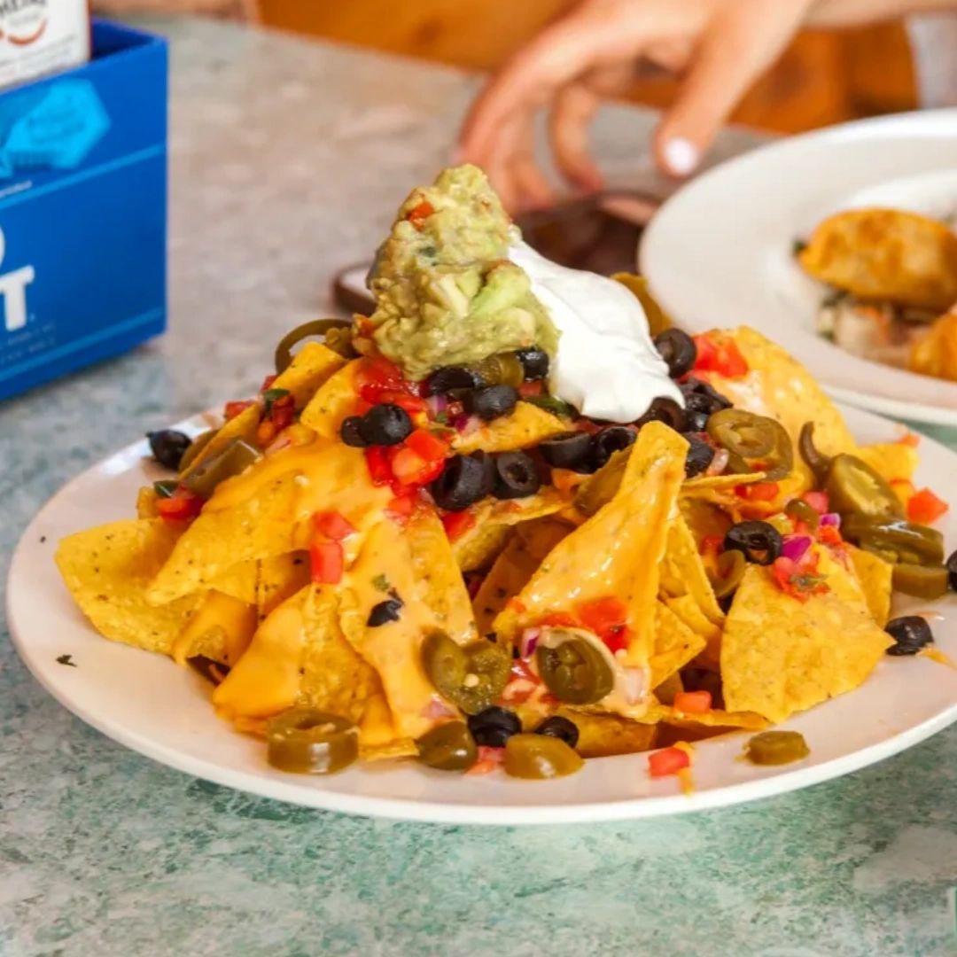 Ooey, gooey, and piled high with salsa, cheese, black olives, and sour cream, our Sandbar Nachos are great for sharing or enjoying all to yourself. Add chicken or beef if you're feeling extra hungry!