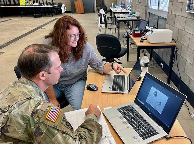 AFHSDPAGE's tweet photo. Army Capt. John Eads, chief medical entomologist at Public Health Command – Pacific, along with Stephanie Cinkovich, a Senior Data Strategist for GEIS, review details for piloting the Battle Ready Risk Report approach to pre-exercise surveillance for Exercise Talisman Sabre 2023. https://t.co/1nEFzsgqRK