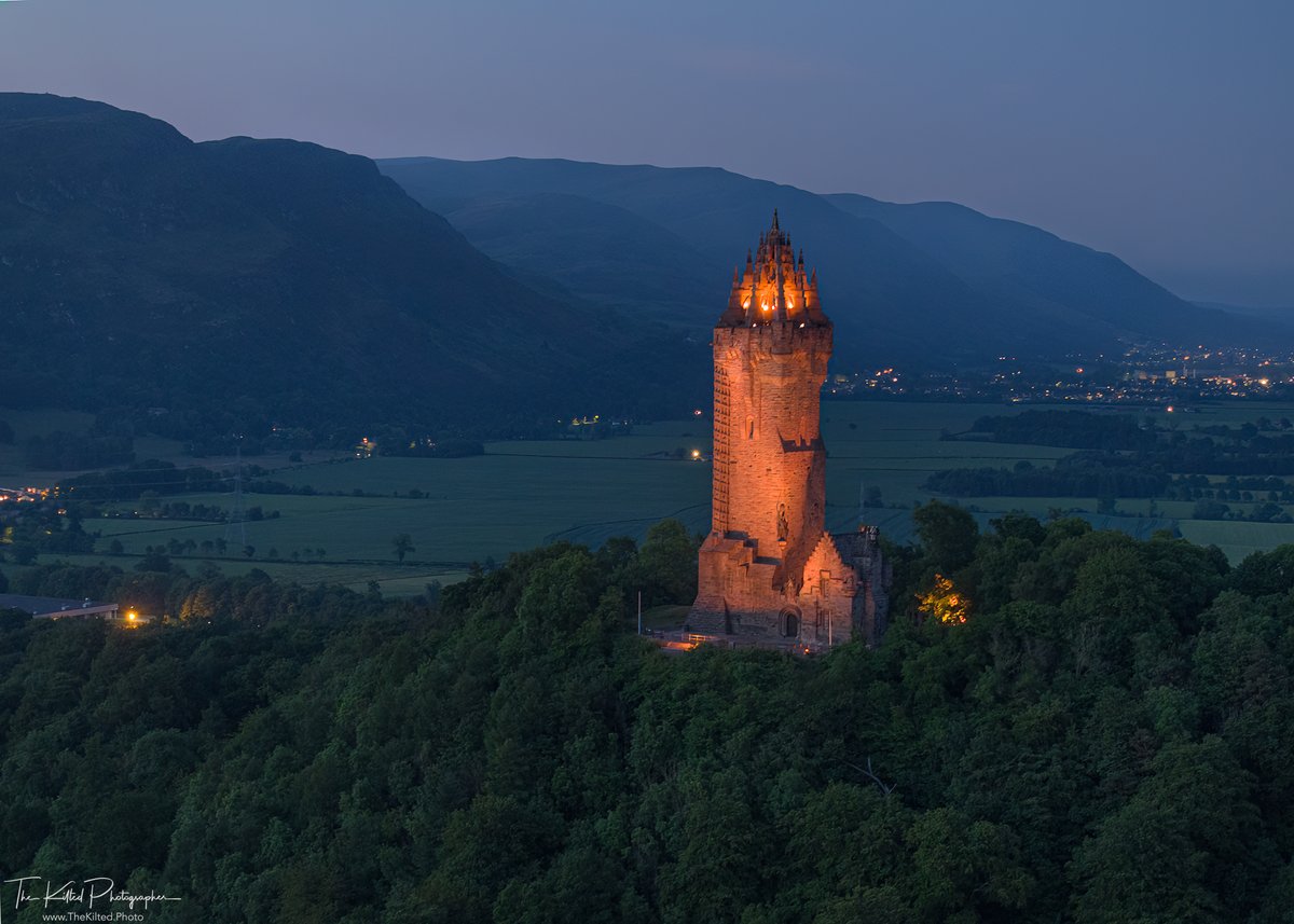 The National Wallace Monument with the Ochil hills in the distance. the monument was illuminated in orange to raise awareness of Batten disease. 

More info: @njrchfoundation @BattenDiseaseuk 

#battendisease #battenawarenessday #wallacemonument #scotland #stirling