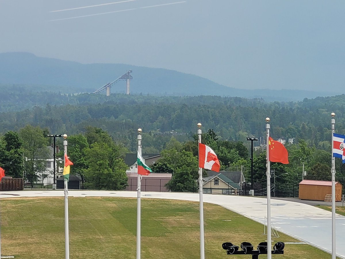 What a cool view. I was taking a pic of the outdoor speed skating rink, and in the background is the ominous looking sky jumps. #LakePlacid