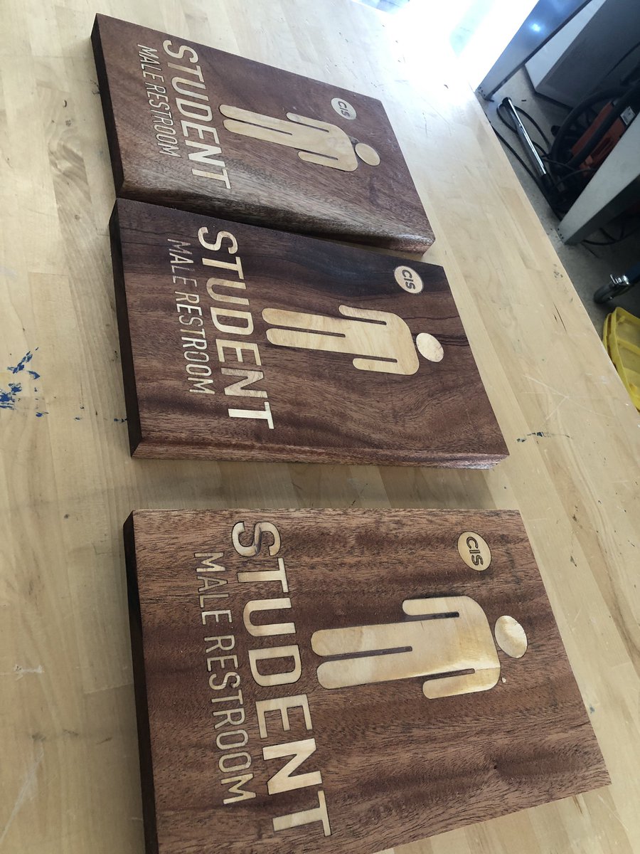 New ES bathroom signs almost done. Ss used maple inlay into some beautiful mahogany pieces. Def an upgrade from the old laminated posters they are currently using. #woodworking #makered #design #issedu #cisinspires