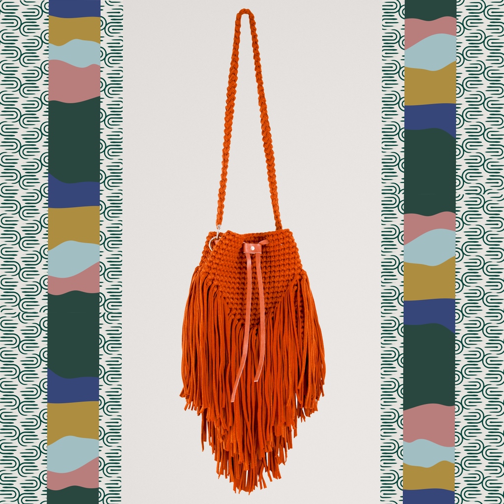In any social circle, this cool and modern tasseled crossbody bag makes the ultimate fashion statement. The tassels add a fun and rustic touch to the accessory, while the crocheted patterns make it one-of-a-kind. 

#ecobag #ethicallysourced #reusedmaterials #craftedwithlove