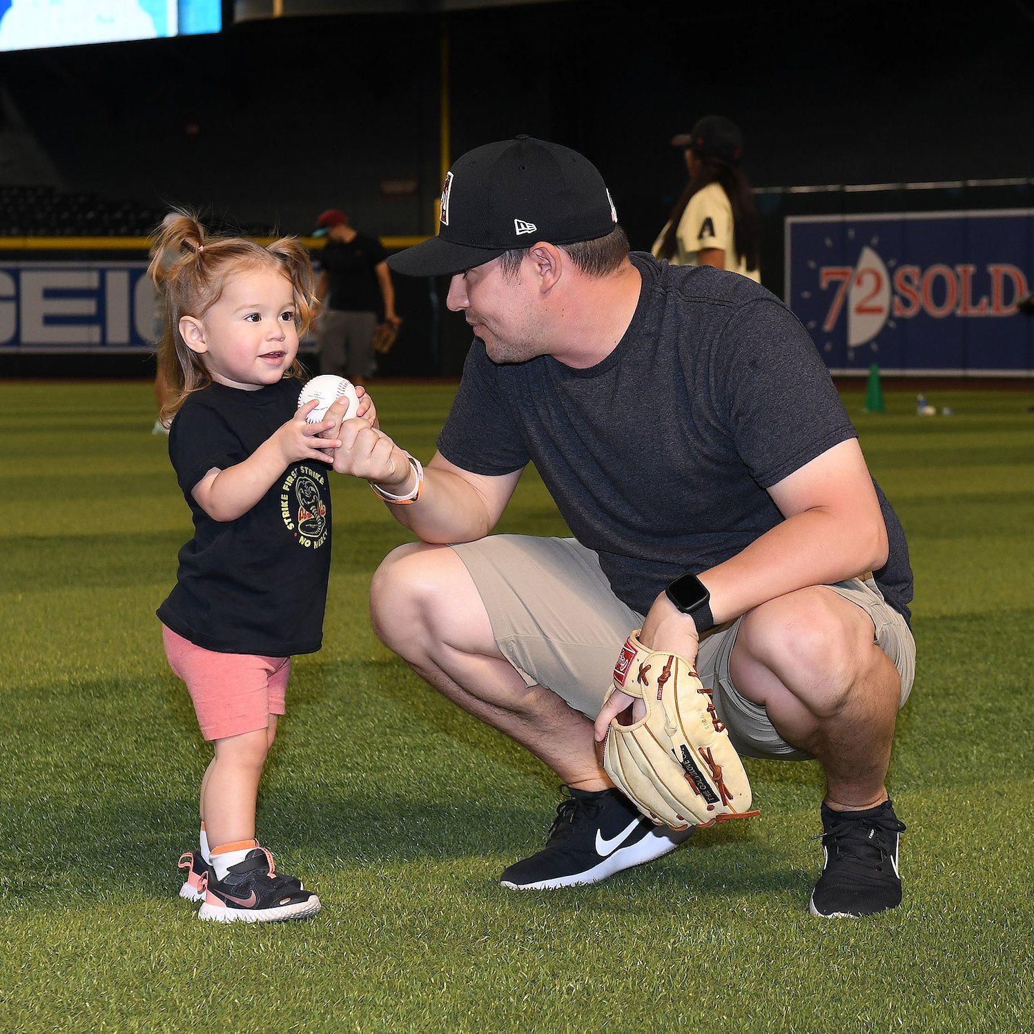Play catch on the field before Diamondbacks game on Father's Day