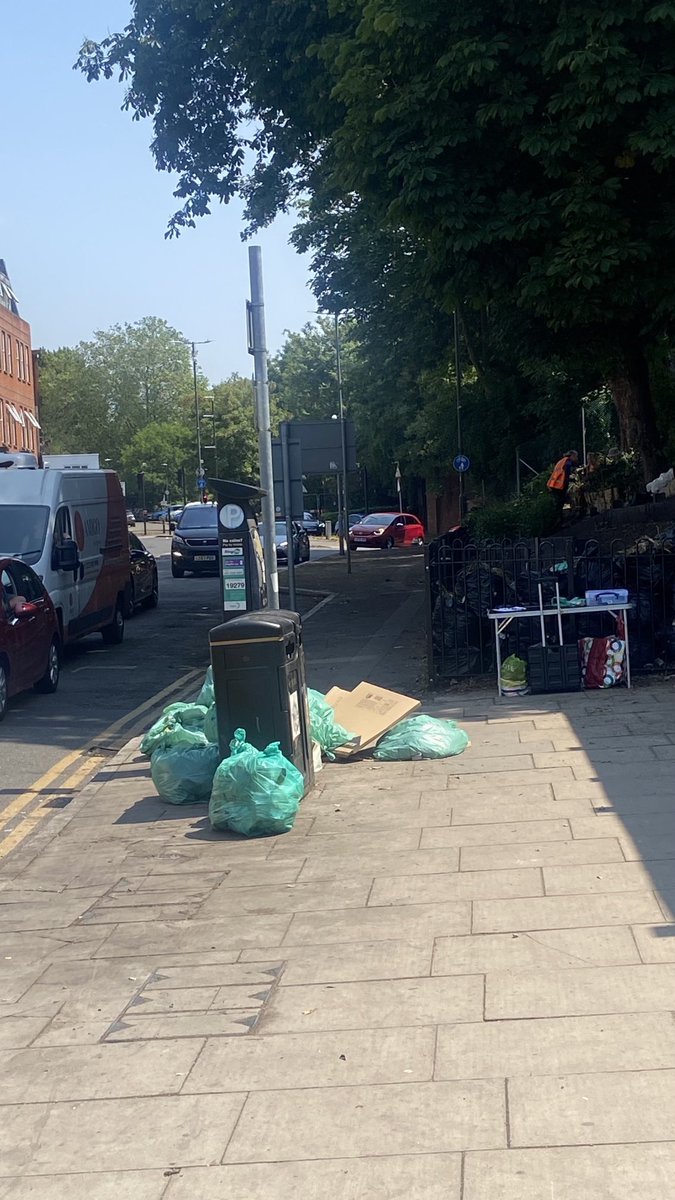 This was the shared cycle & pedestrian path in ⁦@Merton_Council⁩ #RaynesPark today. Street cleaning bags? Not very #BusinessLike for retail footfall either.