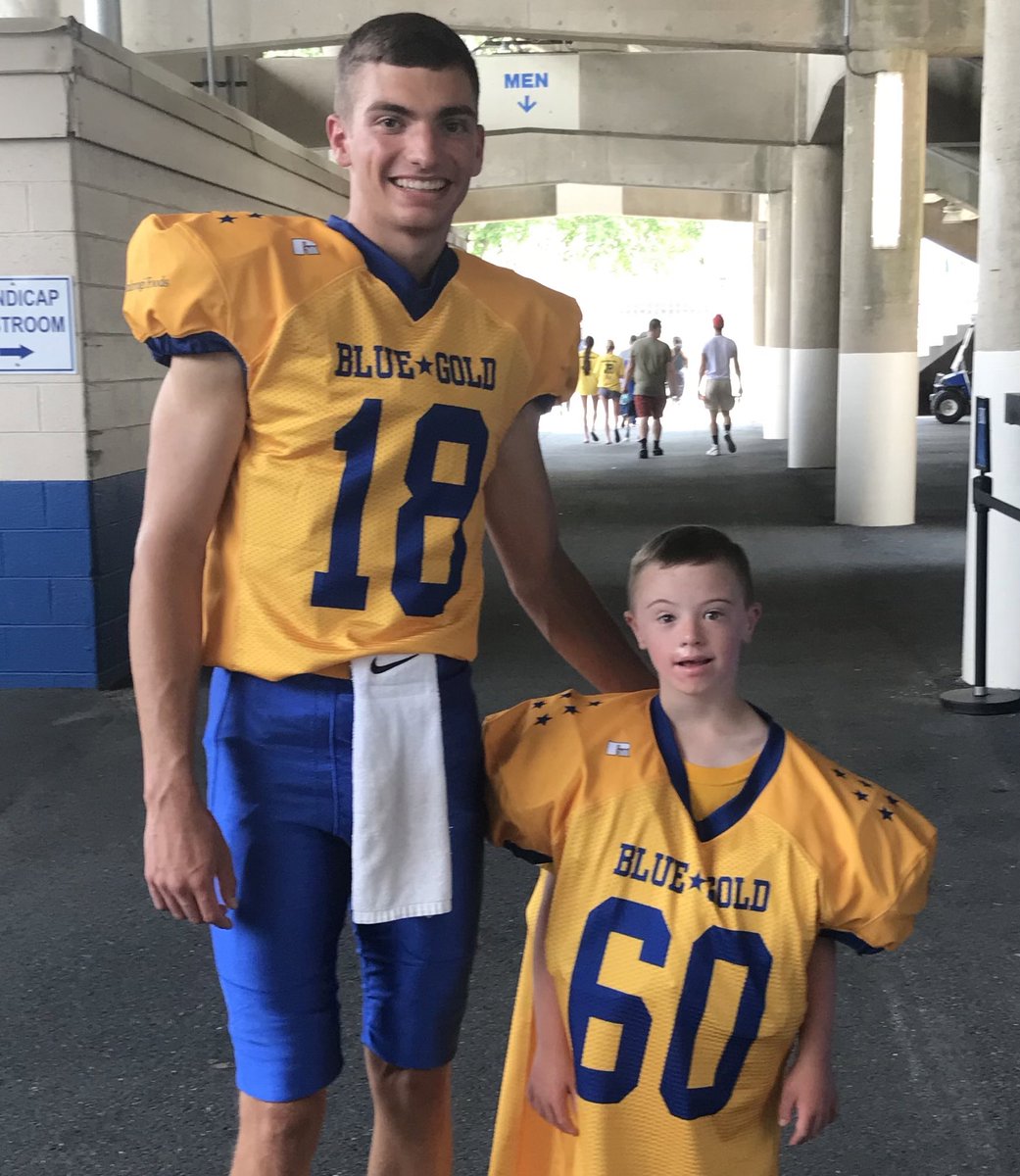 QB Brian Wright of @smyrnahs poses with Garrett Boyles, the coolest guy at @DFRCBlueGold media day. The 67th annual game kicks off at 7 pm Friday at Delaware Stadium. Tickets at dfrc.org #delhs @coachmikejudy