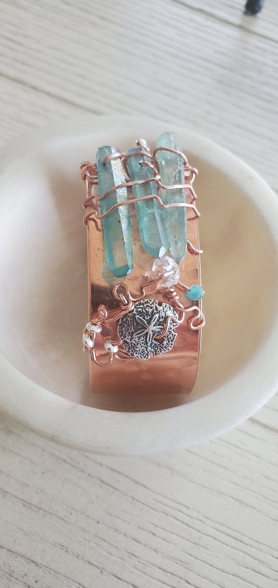 The Water is Copper with Electroplated Blue Quartz with Sterling Silver and Pure Silver Shells, Herkimer Diamond(faceted and one raw), Amazonite , Labradorite.The Single Quartz Is Electroplated Blue Grey Quartz with Labradorite and Amethyst.