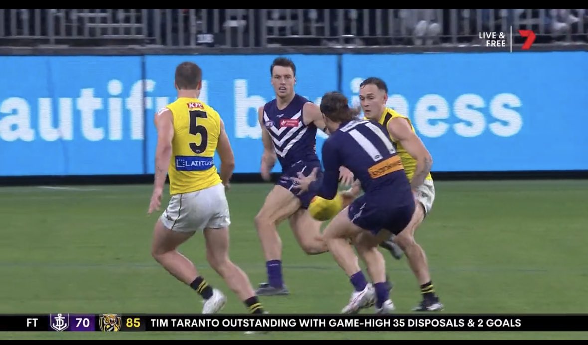 Ball still in dispute 

Tribunal says, you should have tackled or slowed your approach.  If the ball bounced 5cm the other direction, Mansell takes the possession.

@Richmond_FC you have to appeal for the sake of Football.