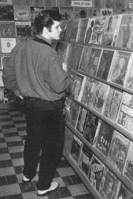 Elvis in a record shop, Memphis, 1957.